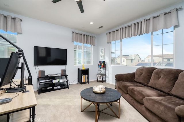 living room with ceiling fan and carpet flooring