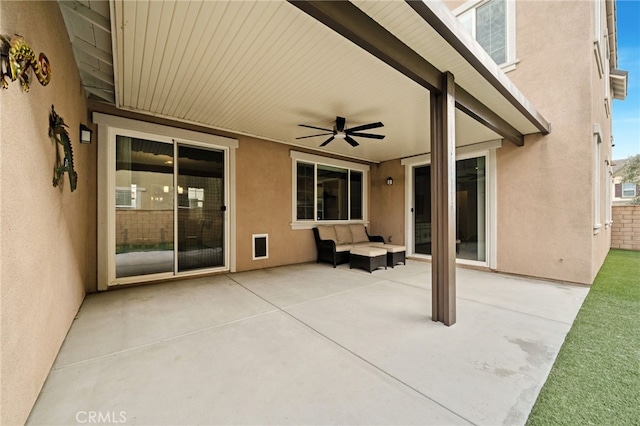 view of patio featuring ceiling fan and outdoor lounge area