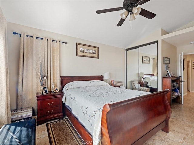 bedroom featuring lofted ceiling, a closet, and ceiling fan