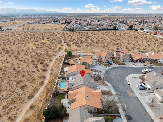 drone / aerial view featuring a mountain view