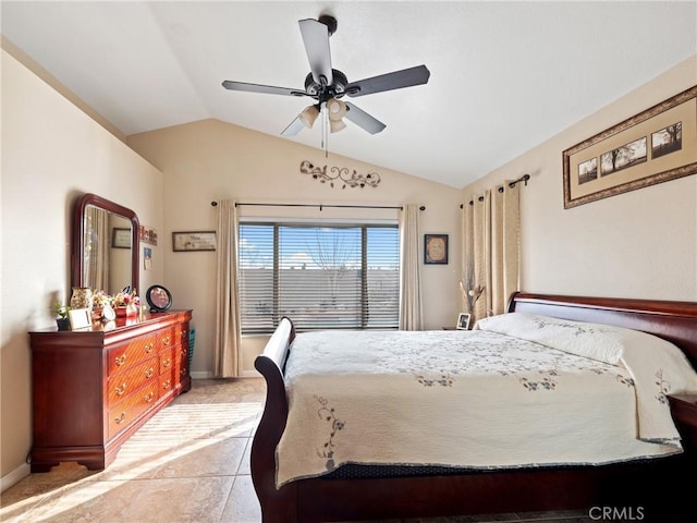 bedroom featuring lofted ceiling, light tile patterned floors, and ceiling fan