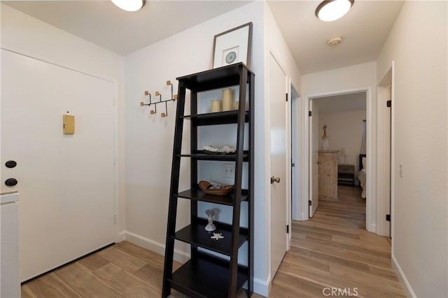 corridor featuring light hardwood / wood-style flooring