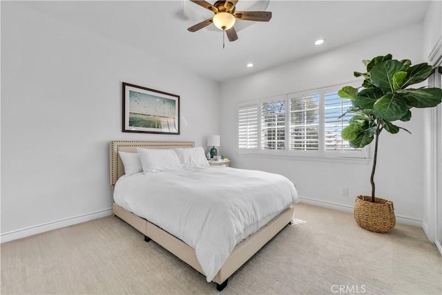 bedroom with a ceiling fan, recessed lighting, light colored carpet, and baseboards