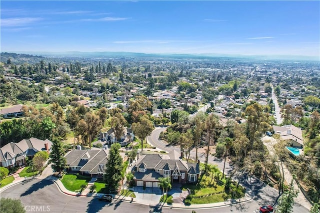 birds eye view of property with a residential view