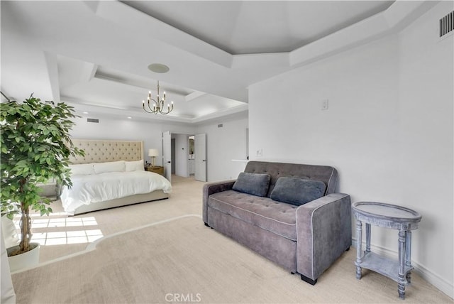 bedroom featuring light colored carpet, a notable chandelier, visible vents, baseboards, and a tray ceiling