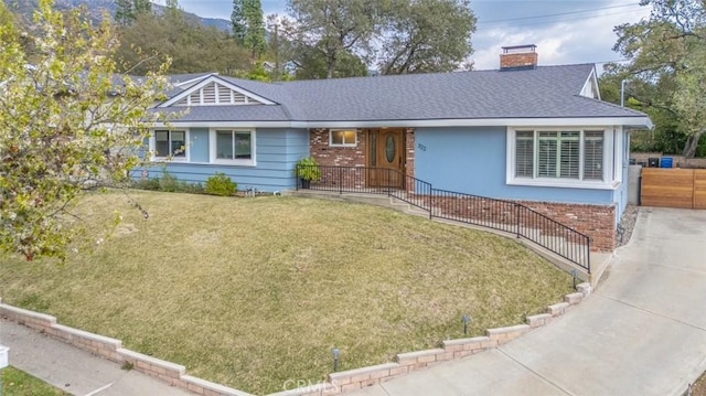 ranch-style house with a front lawn