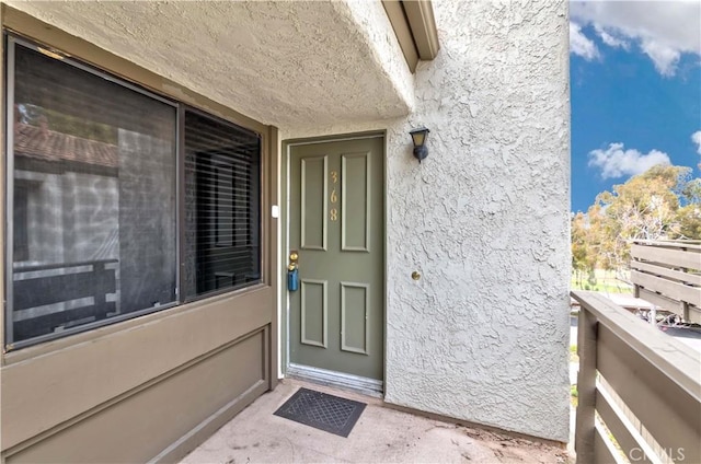 doorway to property with a balcony