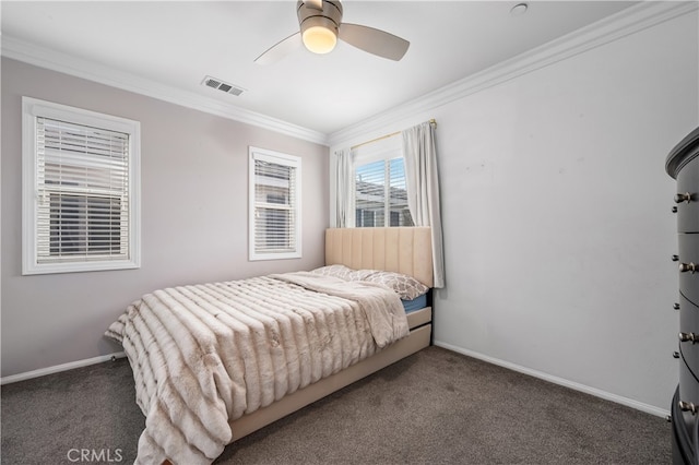 bedroom with ornamental molding, ceiling fan, and dark colored carpet