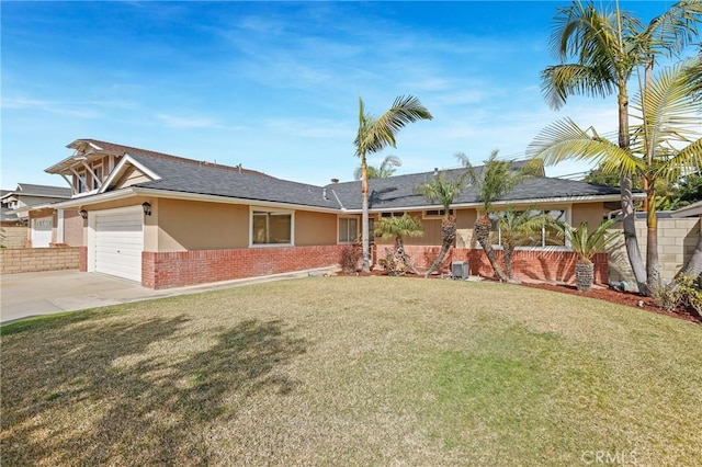 ranch-style home with a garage and a front yard