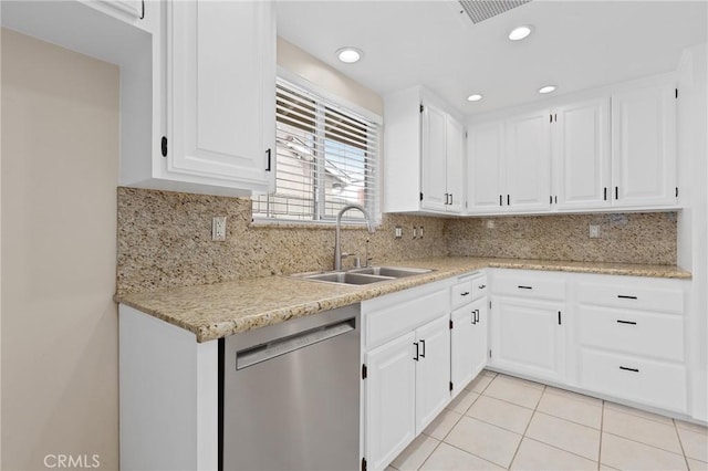 kitchen featuring white cabinetry, dishwasher, sink, and light tile patterned floors