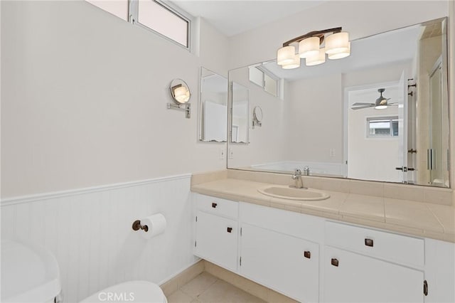 bathroom with vanity, tile patterned flooring, and a wealth of natural light