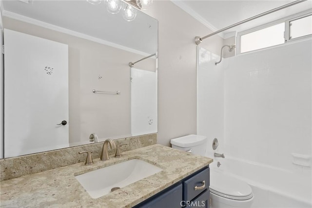 full bathroom featuring vanity, ornamental molding, toilet, and washtub / shower combination