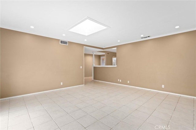 basement featuring crown molding and light tile patterned floors