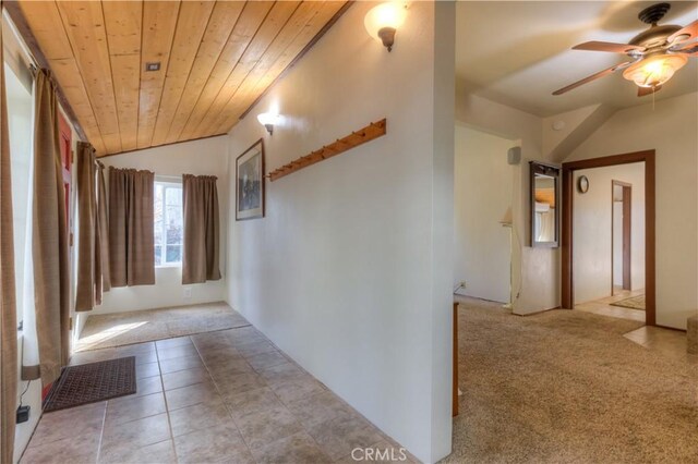 17193 Manzanita St, Stirling City, CA 95978 - hallway featuring light carpet, light tile patterned floors, visible vents, wood ceiling, and vaulted ceiling