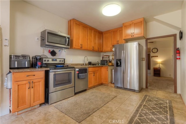 17193 Manzanita St, Stirling City, CA 95978 - kitchen with light tile patterned floors, stainless steel appliances, and a sink