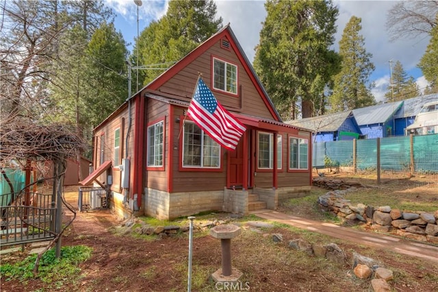 view of home's exterior with fence