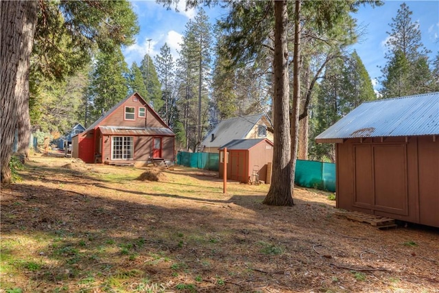 17193 Manzanita St, Stirling City, CA 95978 - view of yard featuring a storage unit and an outdoor structure