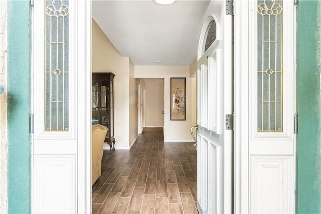 hall with dark wood-type flooring