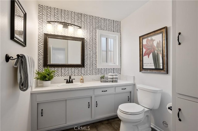 bathroom with vanity and toilet