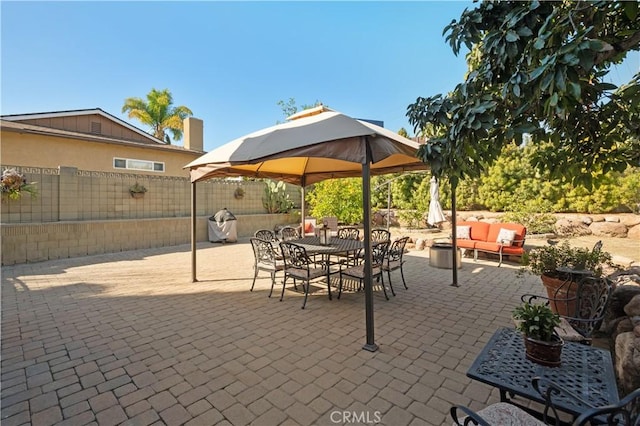 view of patio with a gazebo and an outdoor living space