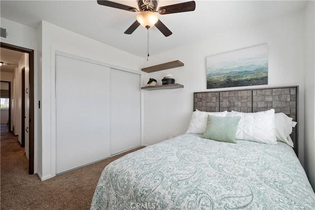 bedroom featuring ceiling fan, carpet flooring, and a closet