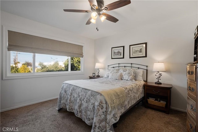 bedroom featuring ceiling fan and dark colored carpet