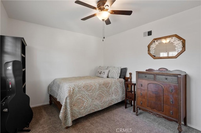 bedroom featuring ceiling fan and dark carpet