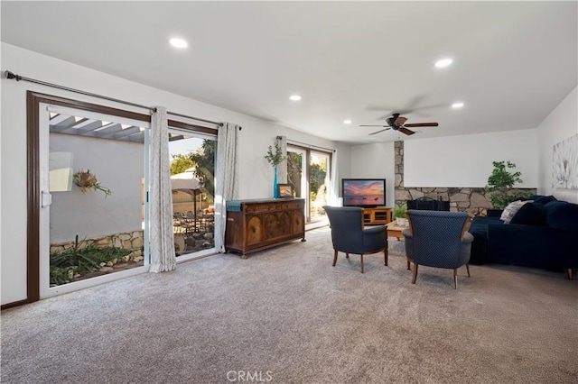 living room with carpet floors and ceiling fan