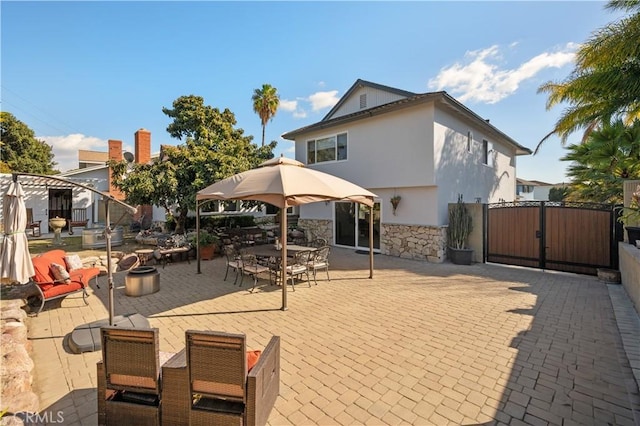 rear view of house with a patio