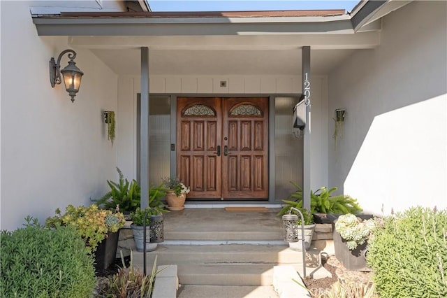 property entrance with covered porch