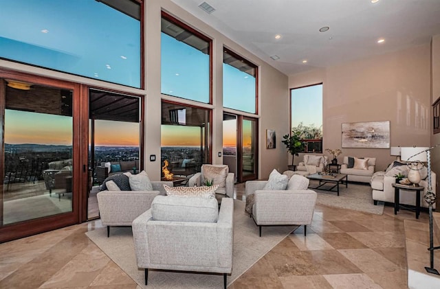 living room with a towering ceiling