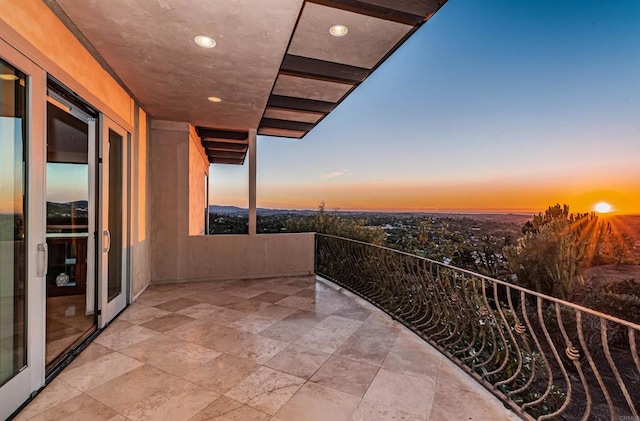 view of balcony at dusk