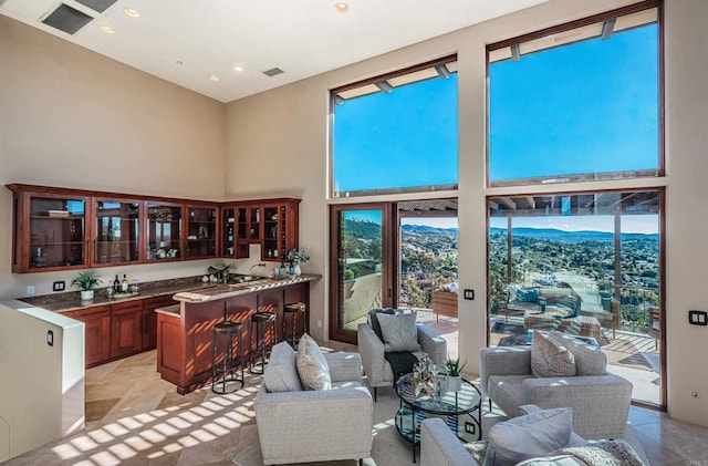 living room with a high ceiling