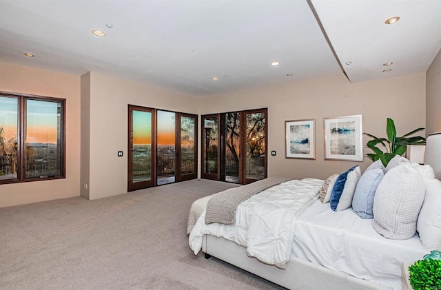 bedroom featuring carpet flooring and access to outside