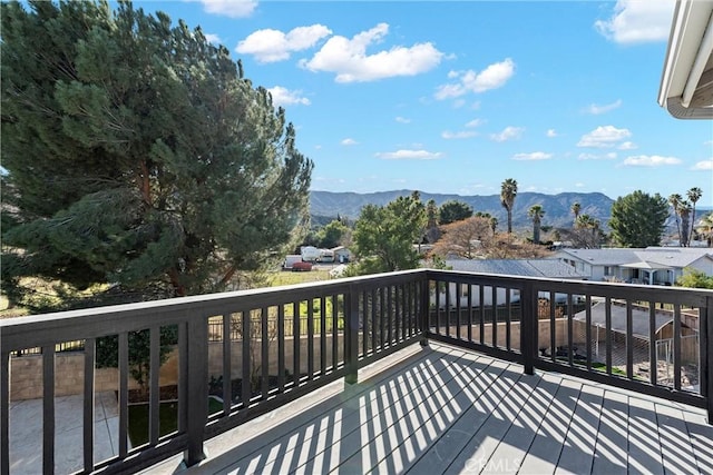 wooden terrace with a mountain view