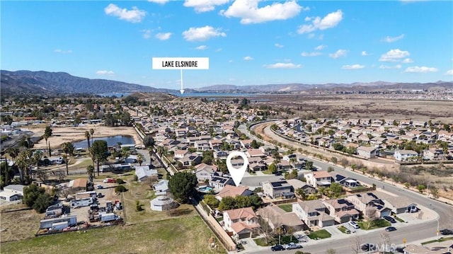 drone / aerial view featuring a residential view and a mountain view