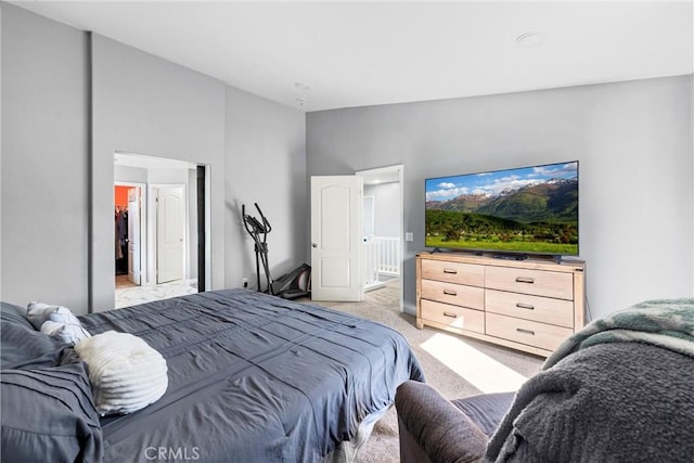 bedroom featuring lofted ceiling and light colored carpet