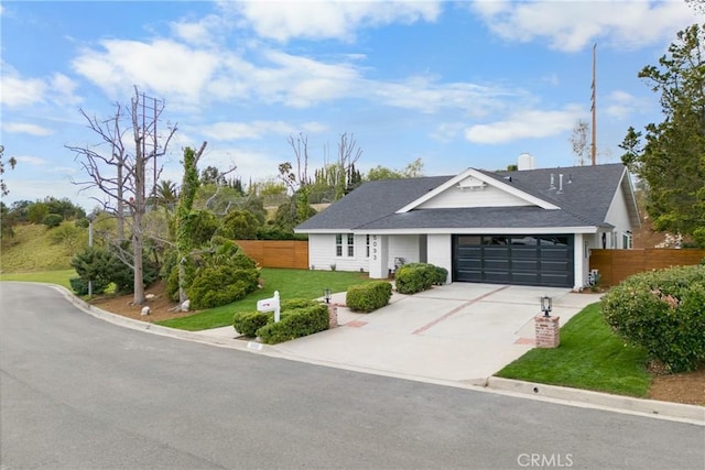 view of front facade featuring a garage and a front yard