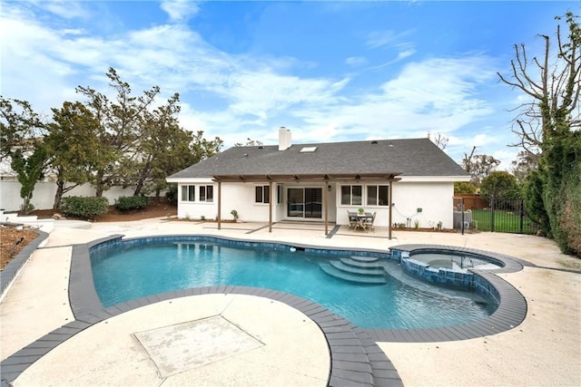 view of pool with an in ground hot tub and a patio area