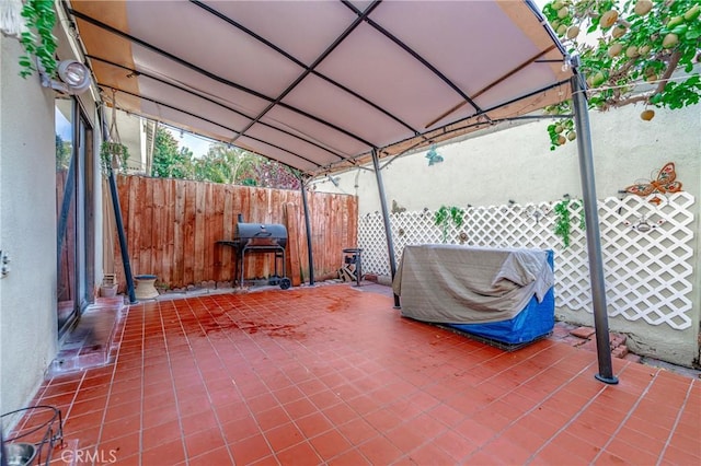 view of patio featuring a grill