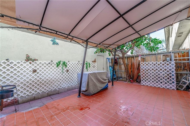 view of patio / terrace with a gazebo and a grill