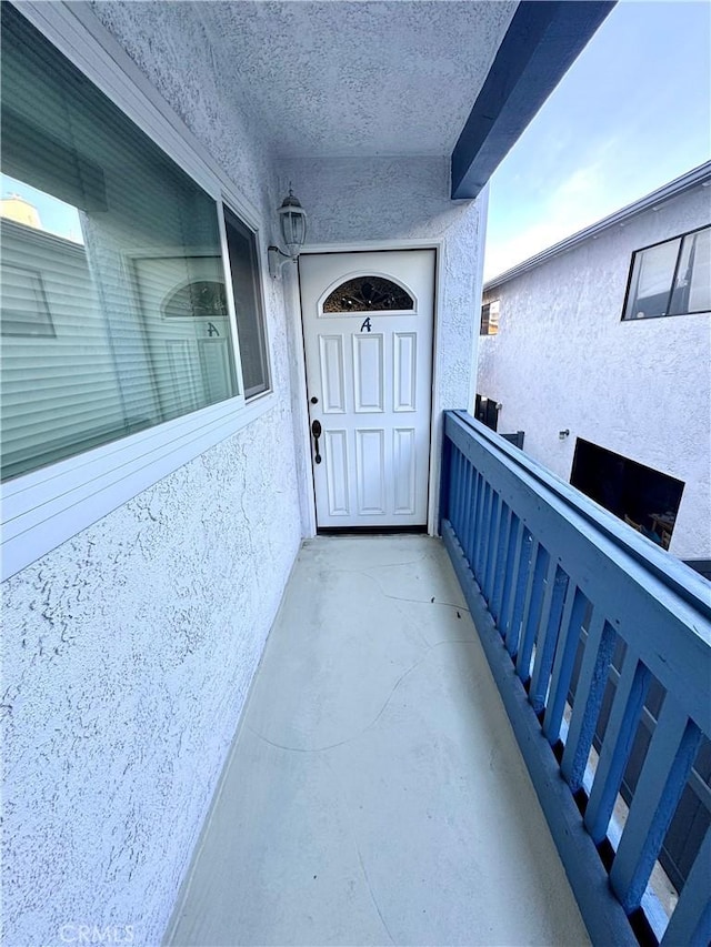 doorway to property with a balcony