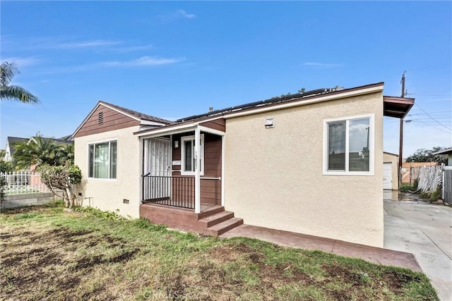 rear view of house with a yard