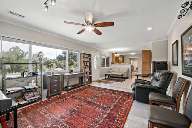 tiled living room with ornamental molding and ceiling fan with notable chandelier