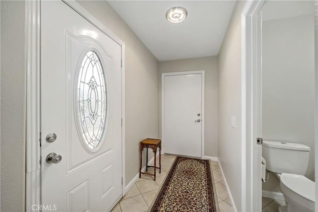 foyer entrance with light tile patterned floors