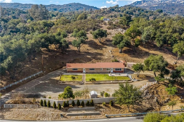 birds eye view of property featuring a mountain view