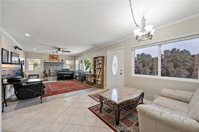 tiled living room with crown molding and ceiling fan with notable chandelier