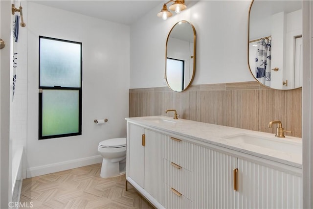 full bathroom featuring shower / bathtub combination, vanity, and toilet