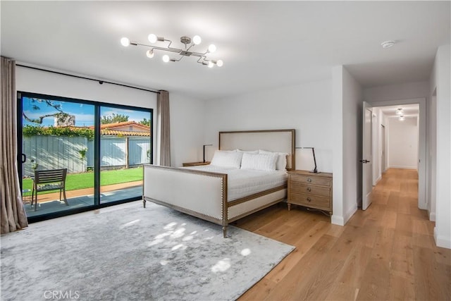 unfurnished bedroom featuring light wood-type flooring and access to outside