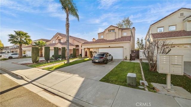 view of front of home featuring driveway, an attached garage, and stucco siding